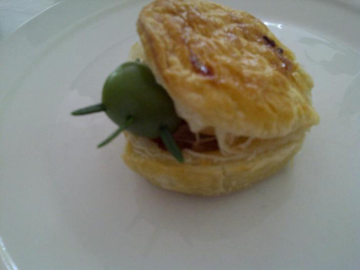 Olive bug crawling out of party pie