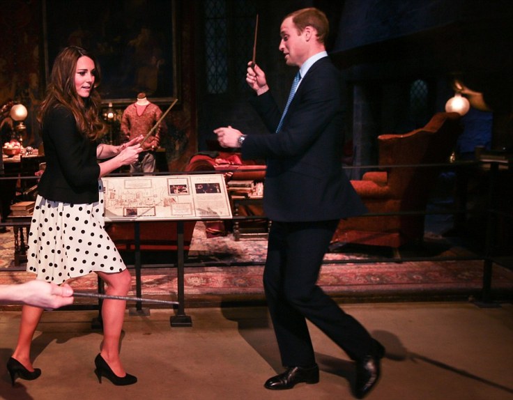 Britain's Catherine, Duchess of Cambridge and Prince William play with magic wands on a Harry Potter set at Warner Bros. Studios Leavesden