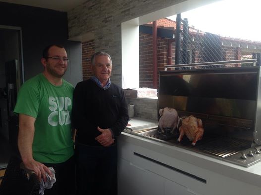 My dad and my sister's bloke Adrian with the beer can chooks.